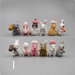 Cute bunny figurines in chef hats, holding carrots and hammers, perfect family gifts