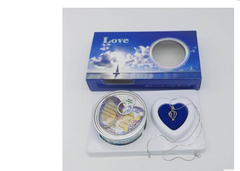 Romantic gift set with heart-shaped pendant, love-themed tin, and blue 'Love' box for couples or Valentine's Day