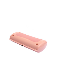 Pink portable pill cutter with textured grip, ideal for travel or daily use