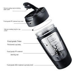 Black portable protein shaker cup with measurement markings, silicone seal, and stirring rod for gym or travel use