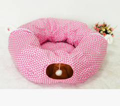 Pink triangle-patterned cat cave bed with hanging pom-pom toy, cozy pet gift