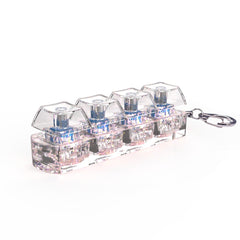Clear acrylic keychain with 4 mini mechanical switches, blue stems, iridescent base, perfect gift