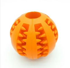 Orange spiky dog chew toy ball for interactive play and dental care