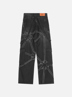 Black cargo jeans with white geometric stitching and distressed patches, back view