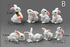 Adorable white bunny figurines in various poses, perfect for home decor or gifts, with size measurements shown.