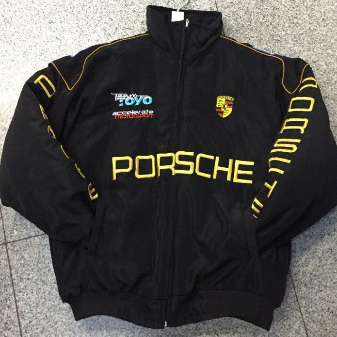 Black Porsche racing jacket with yellow accents and Team TOYO logo, ideal for motorsport fans