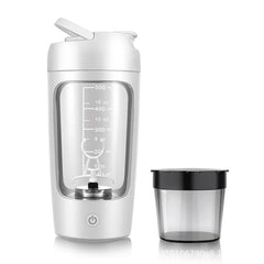 Portable electric smoothie blender with measurement markings and travel cup, ideal for healthy drinks on the go