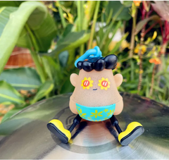 Cute cartoon figurine with flower eyes, blue swim trunks, and yellow shoes, perfect family gift