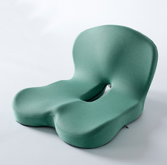 Green ergonomic coccyx cushion for office chair, relieves tailbone pain, supports lower back comfort