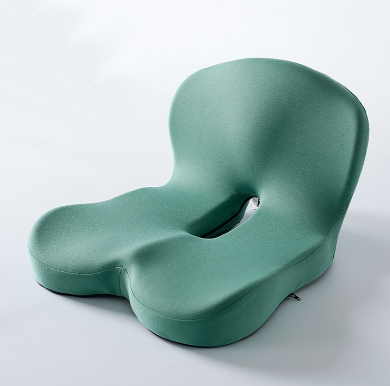 Green ergonomic coccyx cushion for office chair, relieves tailbone pain and improves posture