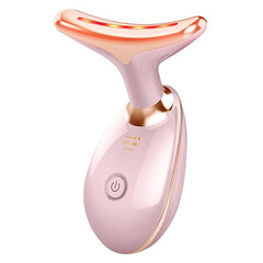 Pink facial massager with LED light therapy for skincare and relaxation