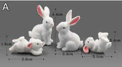 Adorable white bunny figurines in various poses, perfect for home decor or gifts