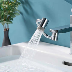 Chrome faucet aerator with water streaming into sink, modern bathroom accessory
