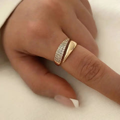 Gold ring with pave diamonds on finger, elegant women's jewelry gift