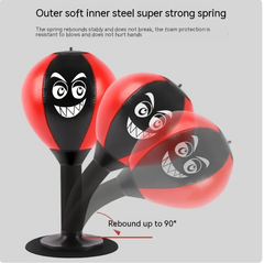 Red and black boxing punch bag with angry face, super strong spring, rebounds up to 90°