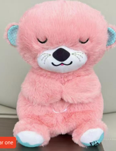 Pink plush otter toy with blue ears and paws, soft cuddly gift for kids and families