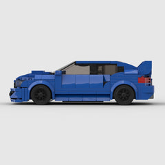 Blue LEGO-style sports car with black wheels and red taillights, perfect gift for car lovers