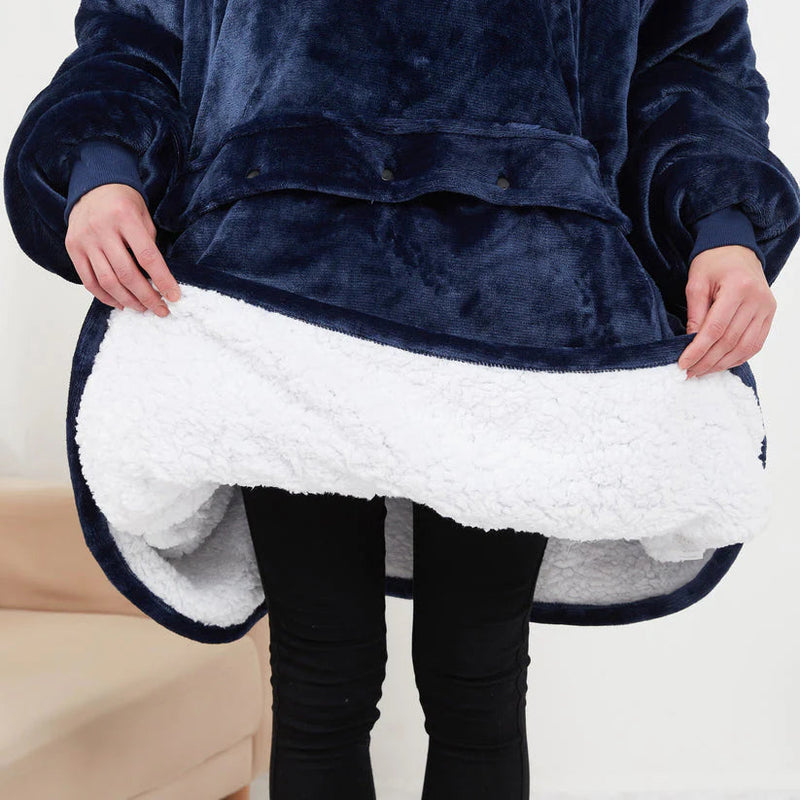 Cozy navy blue weighted blanket with plush white sherpa lining, perfect for relaxing at home