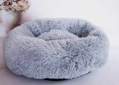 Soft gray fluffy pet bed for cats or dogs, cozy and comfortable for home use
