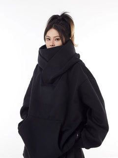 Black oversized hoodie with high neck, cozy streetwear style for women