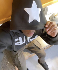 Kid wearing black hoodie with white star, perfect gift for boys, casual streetwear style
