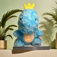 Blue plush dinosaur with yellow crown, glowing heart belly, perfect for kids' gifts and nursery decor