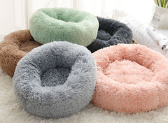 Soft fluffy pet beds in pastel colors, cozy round design for cats or small dogs