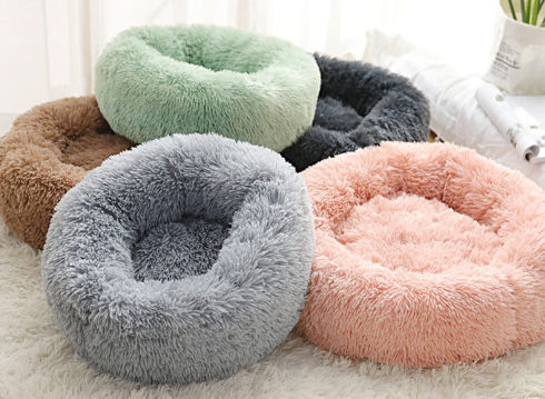 Soft fluffy pet beds in pastel colors, cozy round design for cats and small dogs