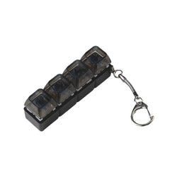 Compact 4-slot pill organizer with keychain, ideal for travel and daily medication management