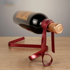 Elegant red ribbon wine bottle holder for gifting, perfect for holidays and special occasions