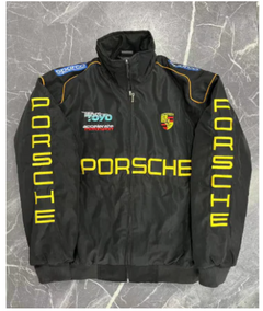 Black Porsche racing jacket with yellow Minnow logo, sponsor patches, and zipper front