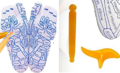 Foot reflexology chart insoles with orange massage tools for relaxation and wellness