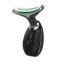 Black facial massager with green LED light, featuring clean and hot modes for skincare