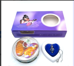 Purple gift box with butterfly design, heart-shaped locket, and decorative tin for family gifts