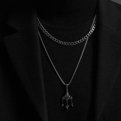 Layered silver chain necklaces with trident pendant, edgy men's fashion accessory