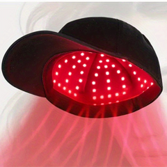 Black cap with red LED lights for scalp therapy and hair growth treatment