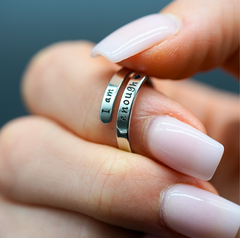 Silver 'I am enough' affirmation ring on hand with pink nails, inspirational jewelry gift