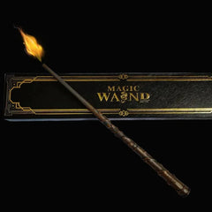 Magic wand with glowing tip, displayed beside elegant black and gold 'Magic Wand' gift box
