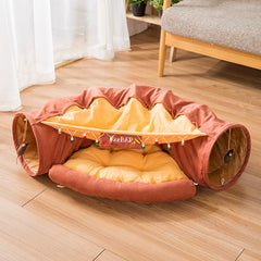 Cozy pet tunnel bed with soft cushion, festive lights, and 'zzz BAR' sign, perfect for cats or small dogs