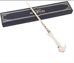 Magic wand with ornate handle, displayed beside elegant gift box for fantasy-themed gifts