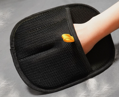 Black mesh foot scrubber with yellow scrub pad, ideal for bath or shower use