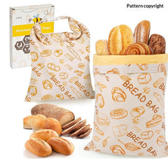 Reusable beeswax bread bags with bakery print, storing fresh loaves and rolls, eco-friendly food storage