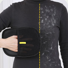 Black mesh lint remover with yellow accents cleaning pet hair from black shirt