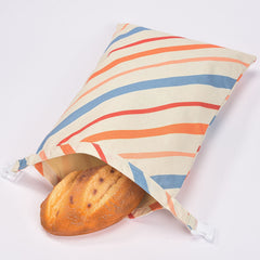 Striped reusable bread bag with loaf inside, eco-friendly kitchen storage