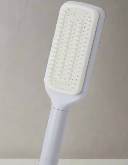 White paddle hairbrush with soft bristles for gentle detangling and daily grooming