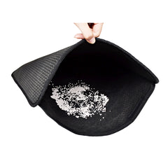 Black cat litter mat with silicone grip, trapping white litter granules for easy cleanup