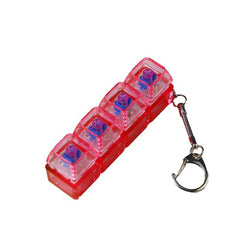 Red 4-compartment pill organizer with keychain, travel-friendly medicine storage