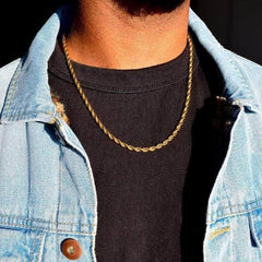 Gold rope chain necklace worn with black tee and light denim jacket, stylish men's accessory
