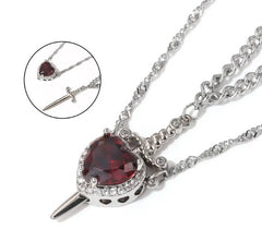 Heart-shaped red gemstone pendant necklace with sword design, silver chain, perfect gift for her
