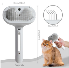 White pet grooming brush with soft bristles, shown grooming a fluffy orange cat, ideal for gentle fur care.